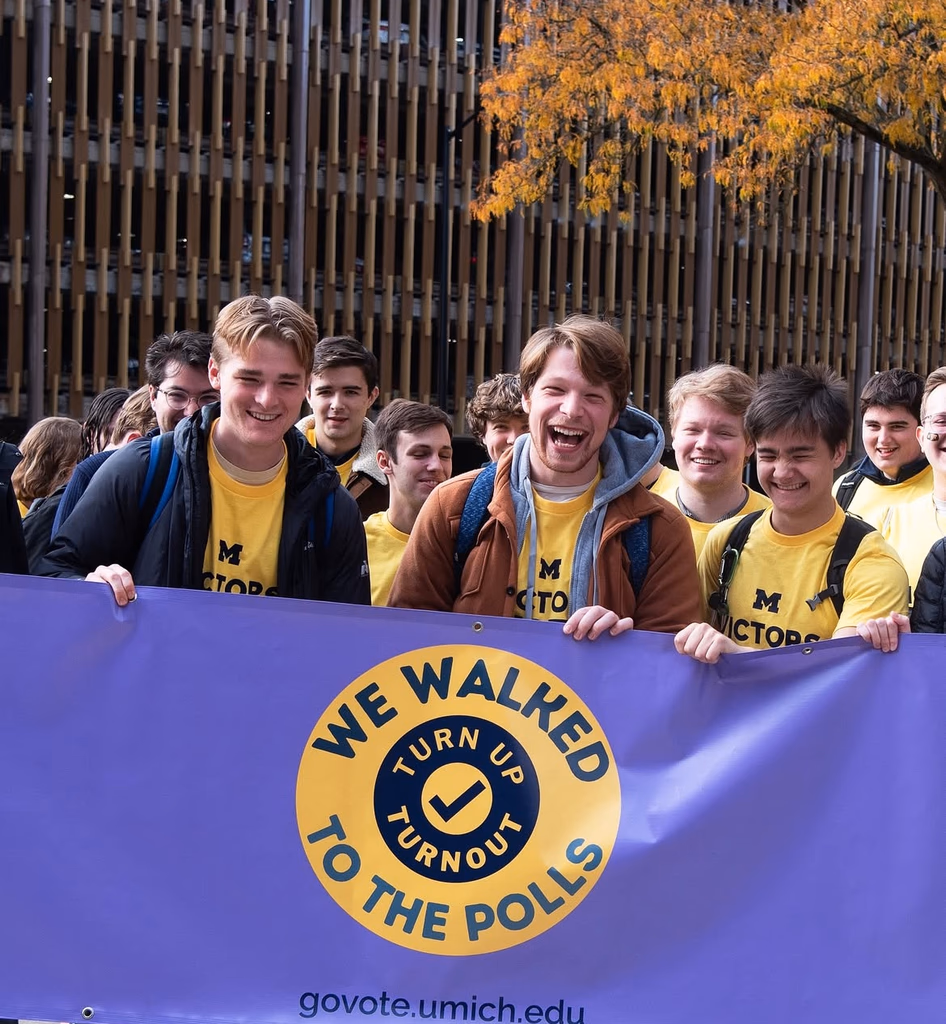 U-M students walking together to cast early ballots at UMMA